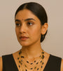 Elegant Multi-Layered Gold Necklace with Black Bead Accents